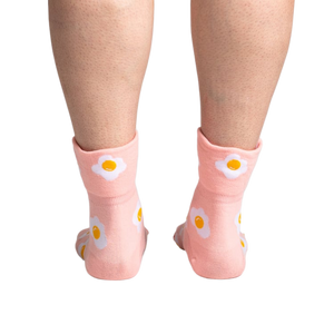 Back view of the socks on a person's legs, highlighting the design on the back of the socks.