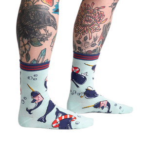 Lifestyle photo showing Whale-y Good Time socks on a model's legs, showcasing the sock's design and fit.
