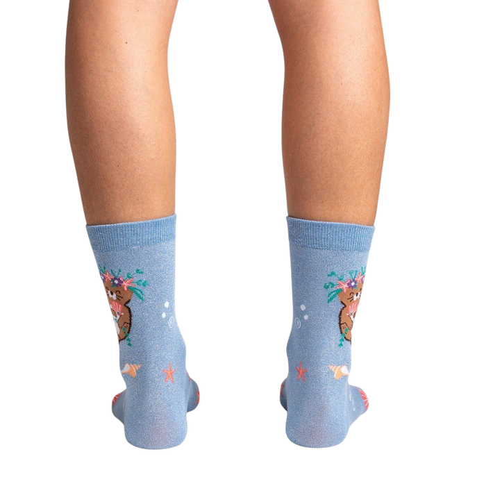 Rear view of the socks on a model's legs against a black background, showcasing the full design.