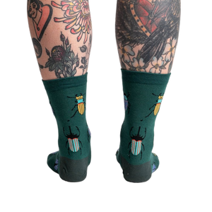Back view of the socks highlighting the beetle pattern on the back of the leg.