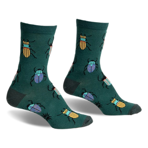 A pair of green crew socks with a whimsical pattern of colorful beetles. Yellow and blue beetles are scattered on a dark-green background.