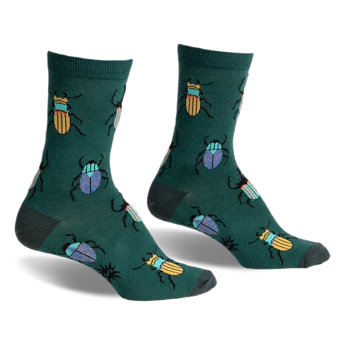 A pair of green crew socks with a whimsical pattern of colorful beetles. Yellow and blue beetles are scattered on a dark-green background.