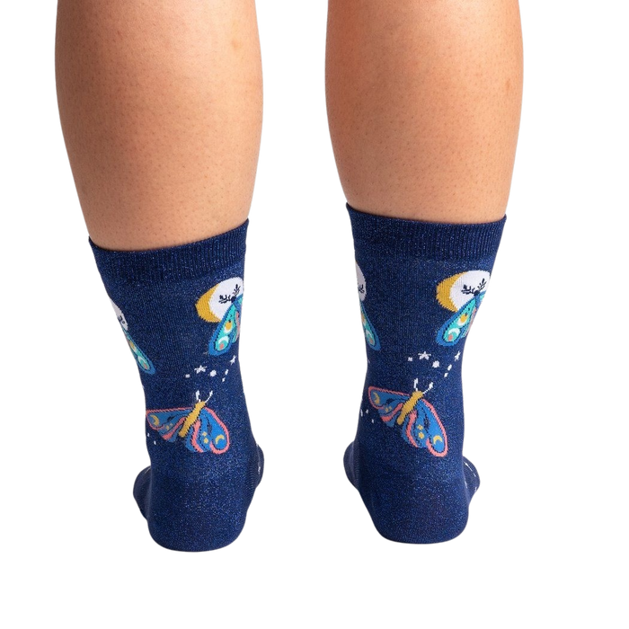 Back view of a pair of Moonlit Moth Shimmer socks on a person's legs, showing the back of the socks.
