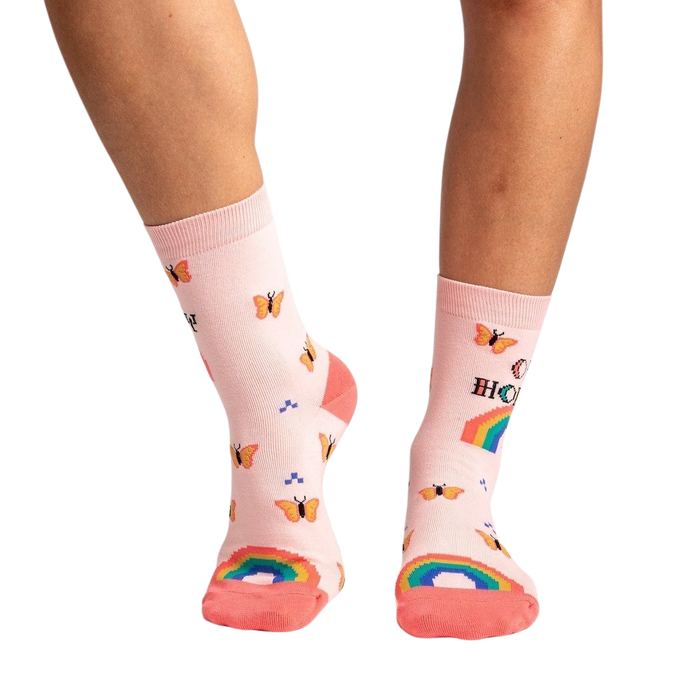 Lifestyle shot showing the socks on a model's legs, highlighting the fit and overall look.