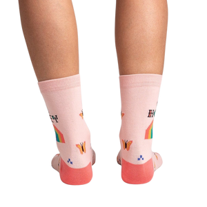 Back view of the socks on a model's legs, showcasing the design details on the back of the socks.