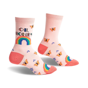Pair of pastel pink crew socks with an 'Oh, Honey' pixelated message, rainbow, and orange butterflies.