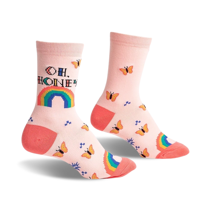 Pair of pastel pink crew socks with an 'Oh, Honey' pixelated message, rainbow, and orange butterflies.