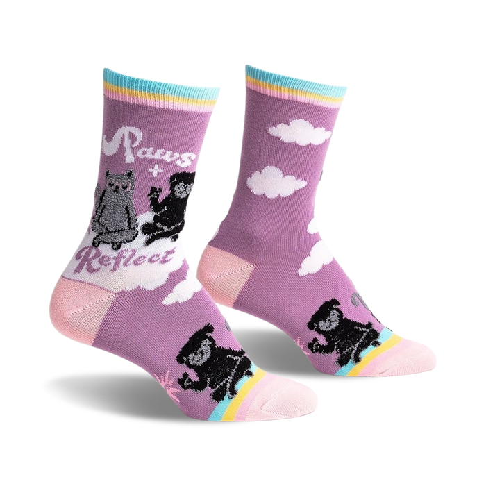Crew socks in purple featuring a cat and dog design on a cloudy background. Pastel rainbow stripes accent the cuffs.