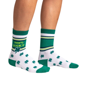 Lifestyle shot showing the socks on a person's legs against a black background.