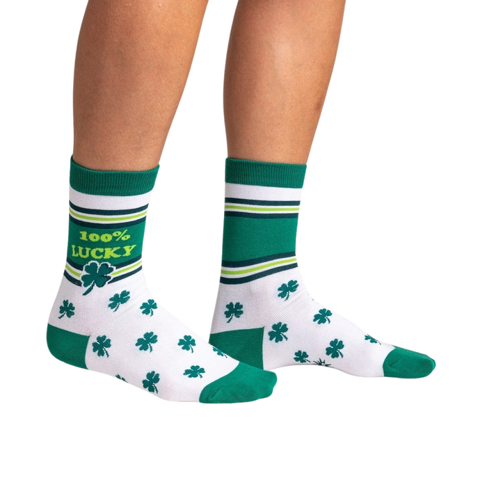 Lifestyle shot showing the socks on a person's legs against a black background.