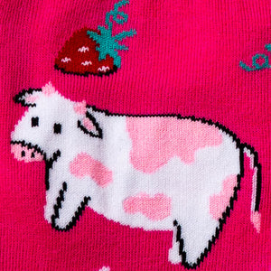 Close-up detail shot of a cow and strawberry design element from Strawberry Milk socks.