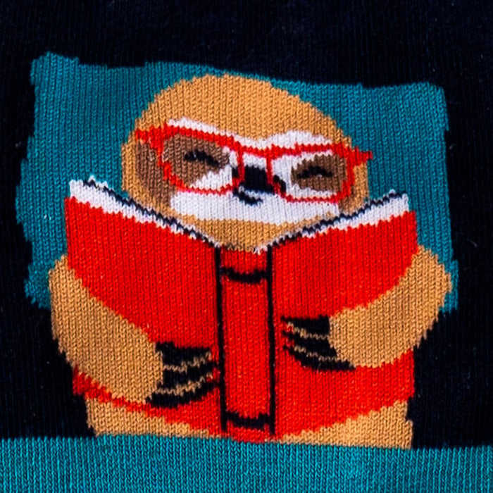 Close-up detail of the sloth reading a book on the sock.