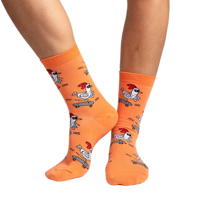 Lifestyle shot of Rad Chicken socks on a person's legs, showcasing how the socks look when worn.