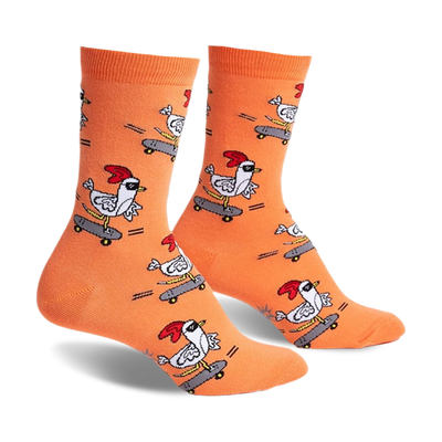 Pair of orange crew socks with a repeating pattern of chickens skateboarding.  The chickens wear sunglasses and red combs.
