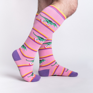 Lifestyle shot showing Rawr-ler Rink socks on a person's legs, showcasing the fit and pattern.
