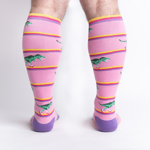 Rear view of a person wearing Rawr-ler Rink socks, highlighting the full sock design from the back.