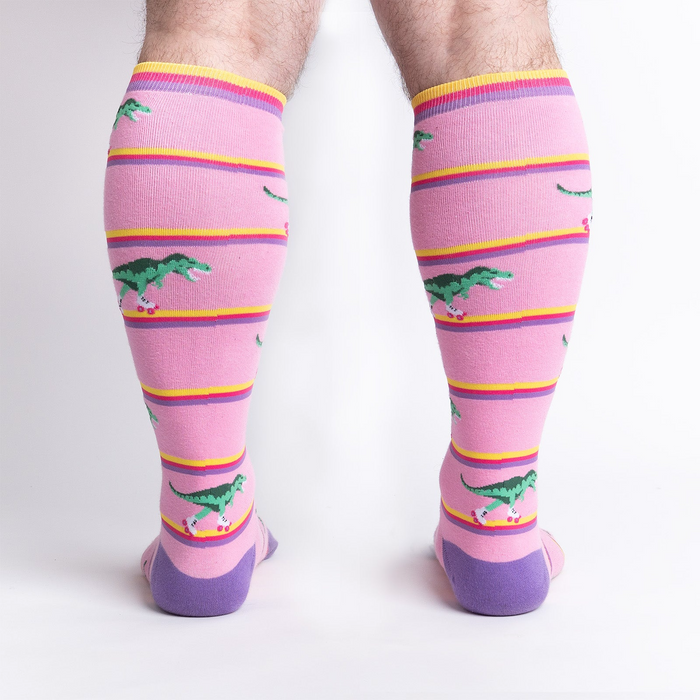 Rear view of a person wearing Rawr-ler Rink socks, highlighting the full sock design from the back.