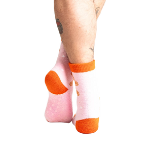 Close-up shot of the back of the pink gingerbread slipper socks.