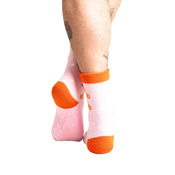 Close-up shot of the back of the pink gingerbread slipper socks.