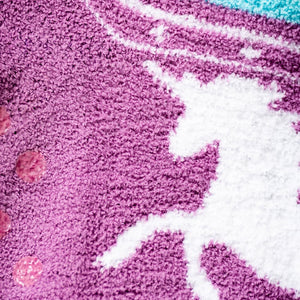 Close-up detail shot of the soft, purple fabric and white unicorn graphic.