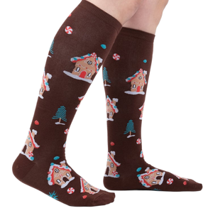 Lifestyle shot showing the socks on a person's legs, showcasing their length and fit.