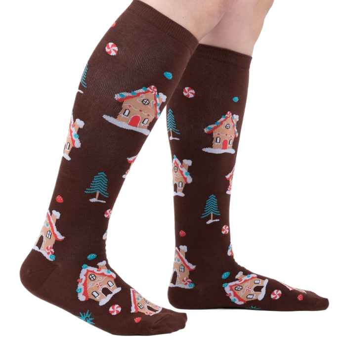 Lifestyle shot showing the socks on a person's legs, showcasing their length and fit.