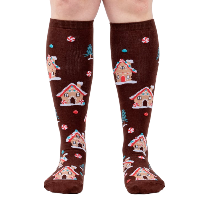 Front view of the socks on a person's legs, highlighting the full design.