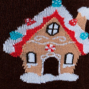 Close-up detail shot of a gingerbread house on the socks, showcasing the intricate knitting.