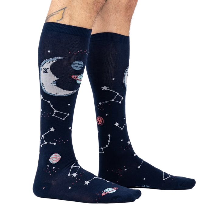 Moonshadow socks on a model's legs, showcasing the glow-in-the-dark feature.