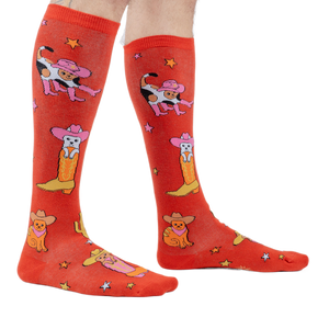 Lifestyle shot showing the 'Herding Cats' socks on a person's legs.