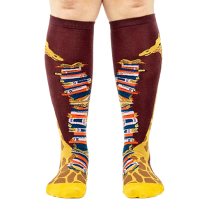Front view of the socks, clearly showing the details of the giraffe and books.