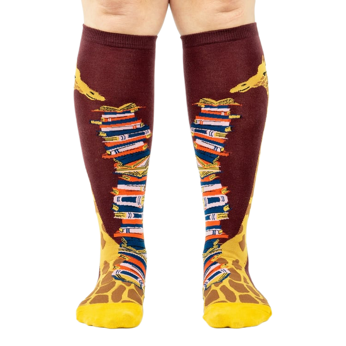 Front view of the socks, clearly showing the details of the giraffe and books.