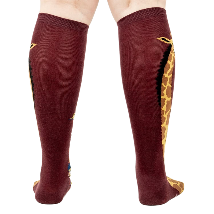 Back view of the socks, highlighting the giraffe design on both socks.