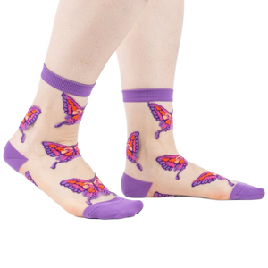 Sheer ankle socks in nude with purple cuffs and colorful butterfly designs.