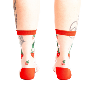 Back view of the strawberry socks, showing the design detail and the red-trimmed ankle.
