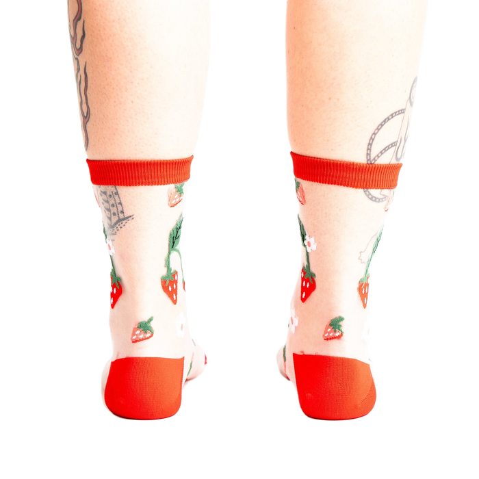 Back view of the strawberry socks, showing the design detail and the red-trimmed ankle.