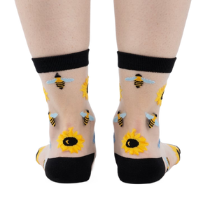 Back view of the sheer sunflower and bee socks, showing the design on the back of the socks.