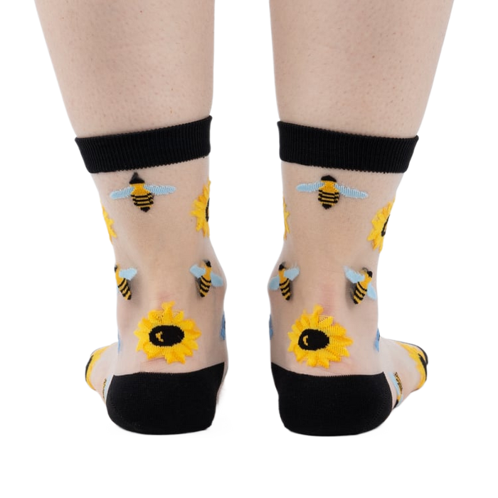 Back view of the sheer sunflower and bee socks, showing the design on the back of the socks.