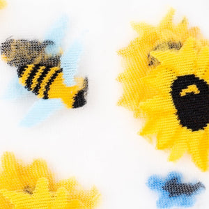 Close-up detail shot showcasing the embroidered sunflowers and bees on the sheer sock fabric.