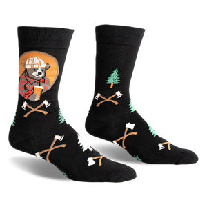 Black crew socks with a lumberjack bear, pine trees, and crossed axes design.  Features pops of red, orange, and green.
