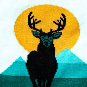 Close-up detail shot of the deer design on the socks, emphasizing the color and texture.