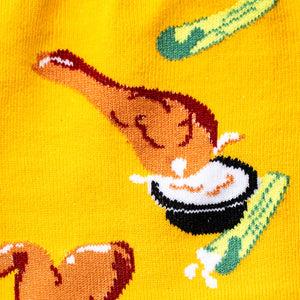 Close-up detail shot showcasing the fried chicken and sauce design on the yellow socks.