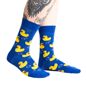 Lifestyle shot of a person's legs wearing the Rubber Duckie socks, showcasing the fit and design on a person.