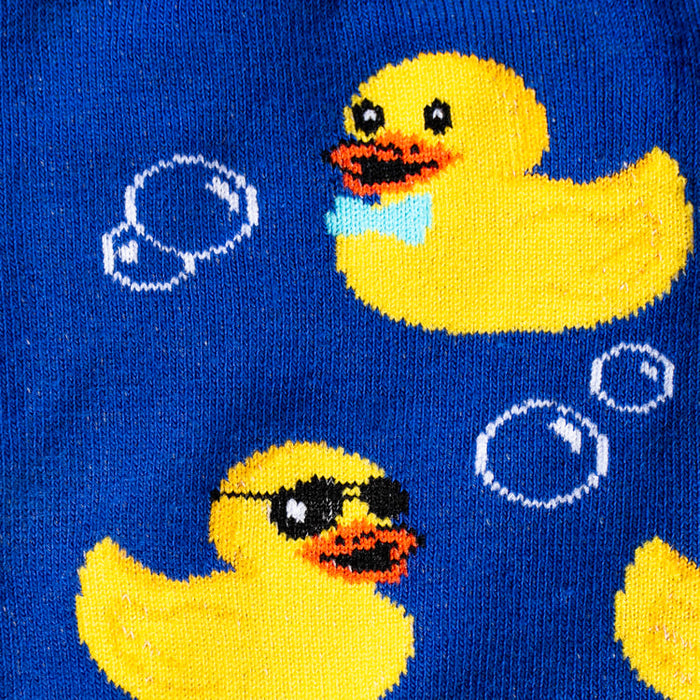 Close-up detail shot showcasing the intricate design of the yellow rubber duck and bubble print on the blue socks.