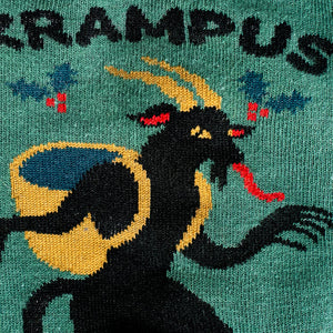 Close-up detail shot highlighting the Krampus illustration on the socks.