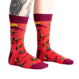 Lifestyle shot showing the 'Jolly Rancher' socks on a model's legs, showcasing the fit and overall look.