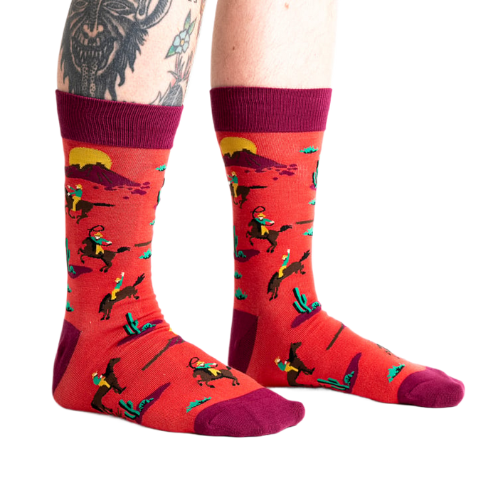 Lifestyle shot showing the 'Jolly Rancher' socks on a model's legs, showcasing the fit and overall look.