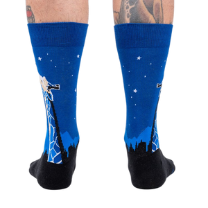 Rear view of 'Stand Tall' socks on a person's legs.