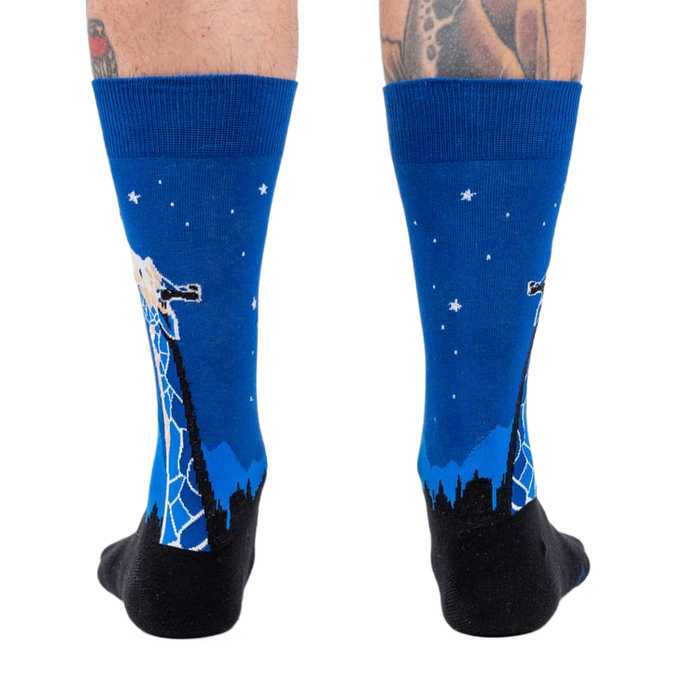 Rear view of 'Stand Tall' socks on a person's legs.