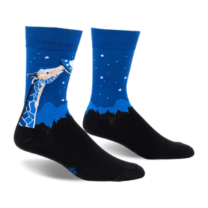 Pair of blue and black crew socks. Design features a giraffe looking up at a UFO against a night sky with stars and a silhouetted landscape.